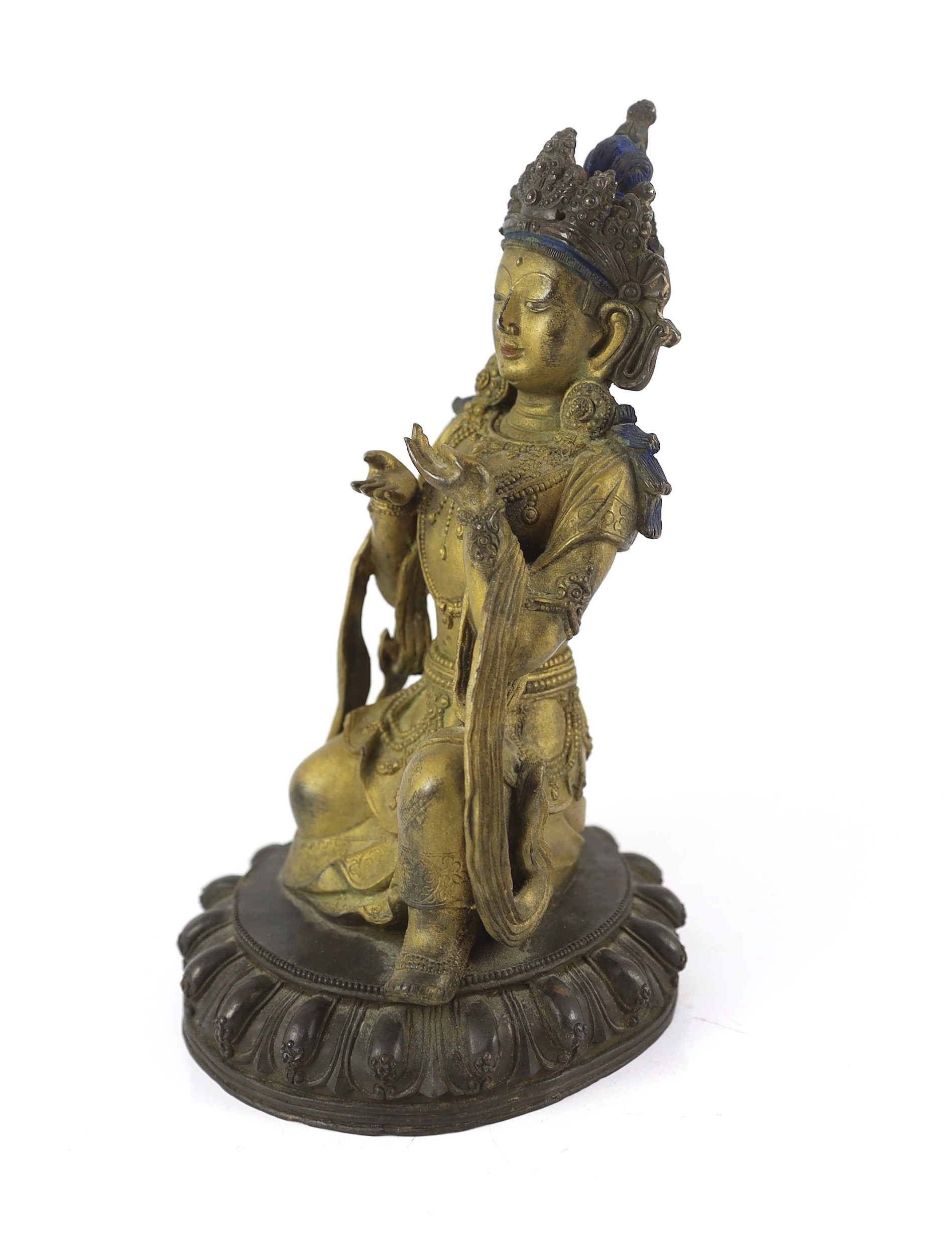 A Chinese gilt bronze figure of a kneeling Bodhisattva